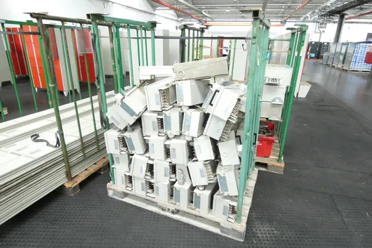 Lot of electrical/industrial supplies, with storage racks