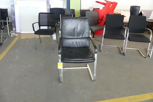 Cantilever chair with armrests, upholstered