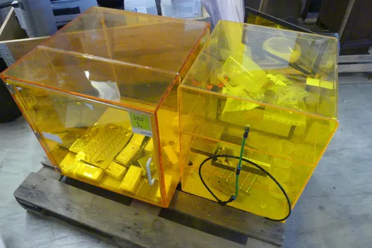 2x Acrylic cabinet, orange, with contents